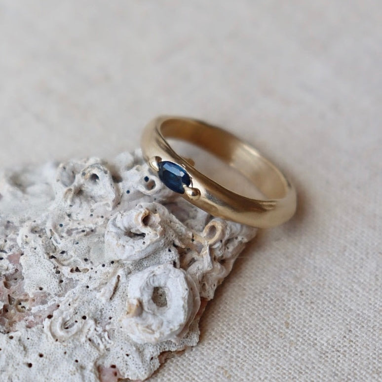 Deep Blue Sapphire on a Molten Gold Band